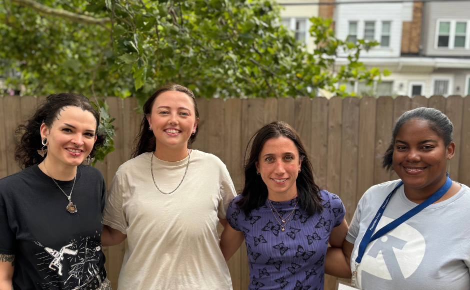 four ppp staff look at the camera