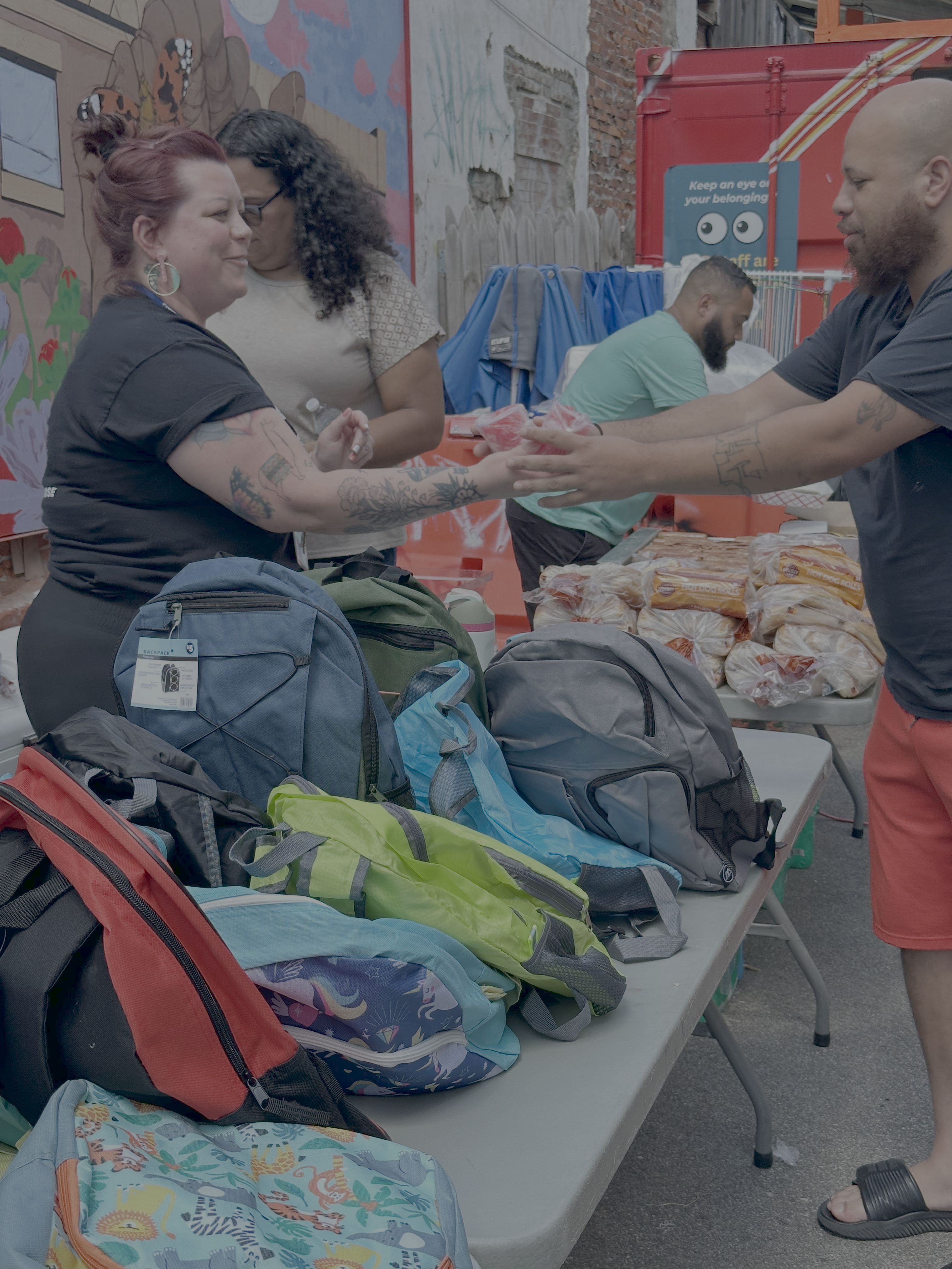 Prevention Point staff giving out water ice