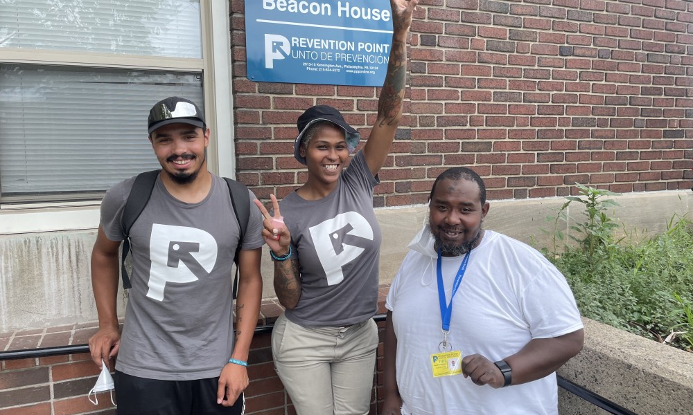 Joel, Taylor, and Ronald in front of Beacon House.