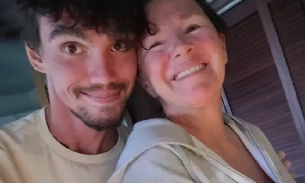 Theo and his mother Germaine smile at the camera