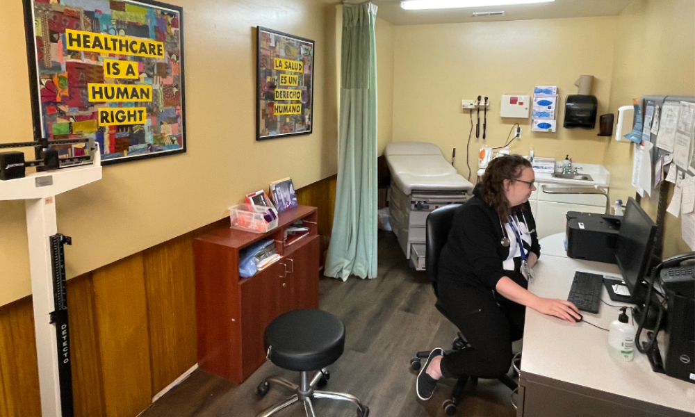 Dr. Meisner sits at her desk in the clinic.