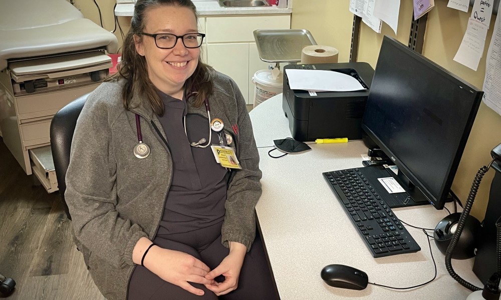 Dr. Meisner sits at her desk in the clinic.